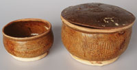 Chinese jars of unknown origin, with ill-fitting lids, sometimes unglazed. Height 10 and  14.5cm.