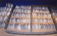 Plates from the 'Royal Nanhai', c.1460, stacked between replica bulkheads at Muzium Negara.