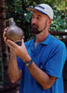 Conservation: Jon Carpenter with beardman jug, 1999. Photo by Patrick Baker.